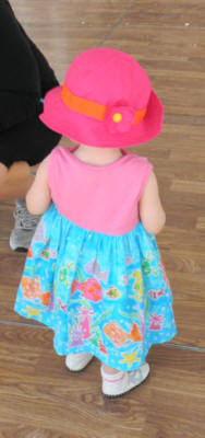 3 year-old in pink bonnet