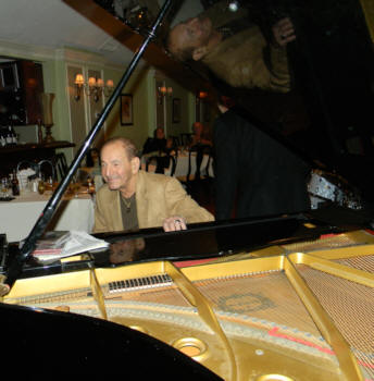 Al smiling at the Sherborn Inn's Baby Grand