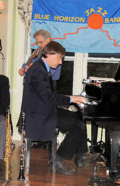 Ross Petot piano, Gerler behind him, with Blue Horizon Flag