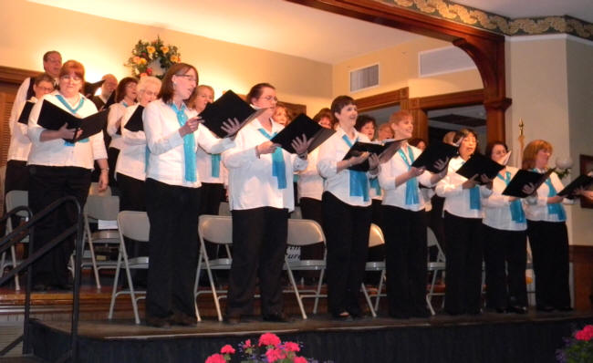 chorus standing and singing