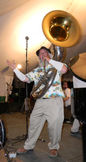 Albie, with big white beard, posing face front with tuba