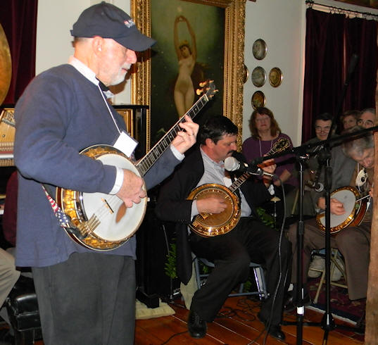 Joel standing, Bob & Jimmy sitting, all on banjo