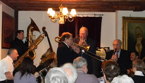 Herb on extended trombone, with 
			Lew and Noel and the rest of the band