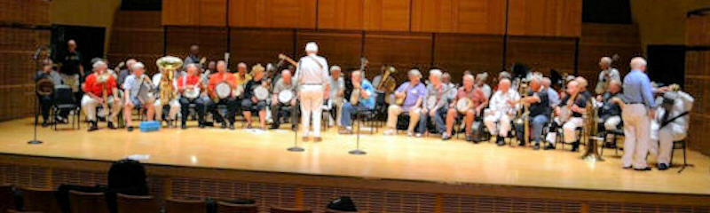 Carnegie Hall stage full of banjo players