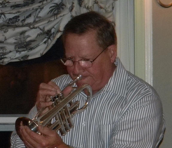 MacInnis using hand for mute on cornet