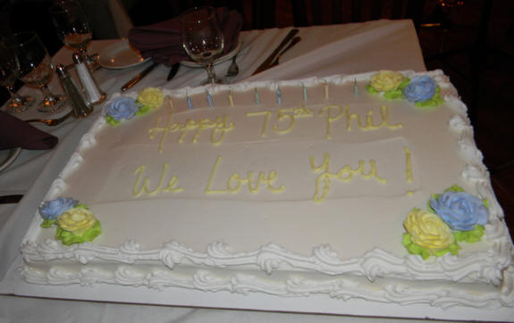 half sheet cake that says Happy 75th Phil, We Love You!