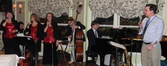 3 vocalists, Ken Steiner string bass, Ross Petot piano, John Clark singing