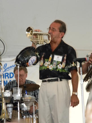 Freddy playing cornet with one hand