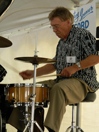 Bill Logozzo's drum sticks a blur as he strikes the snare drum